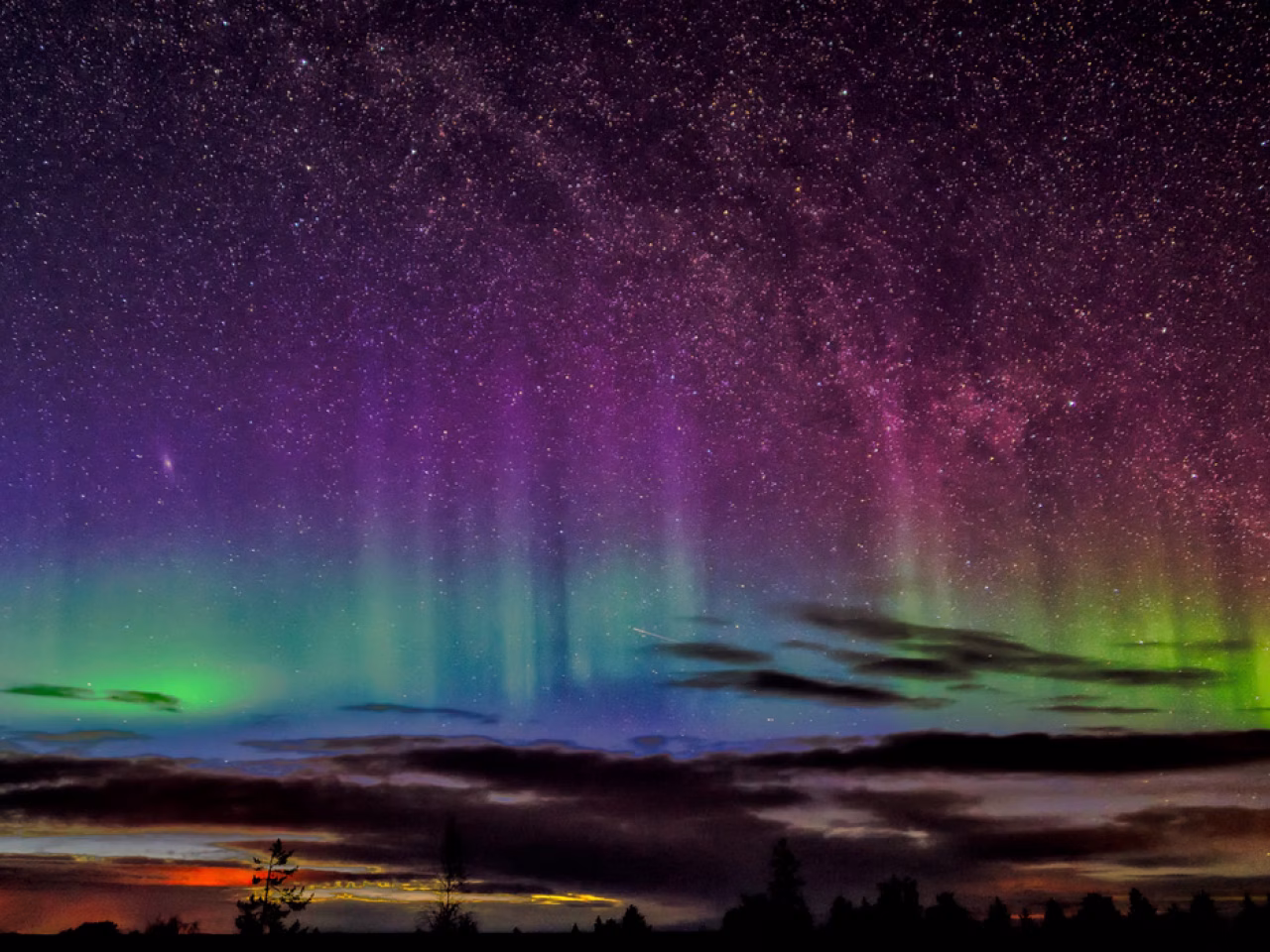 Aurora expert Donald Burghardt explaining the Northern Lights during a special aurora dinner experience in Rovaniemi